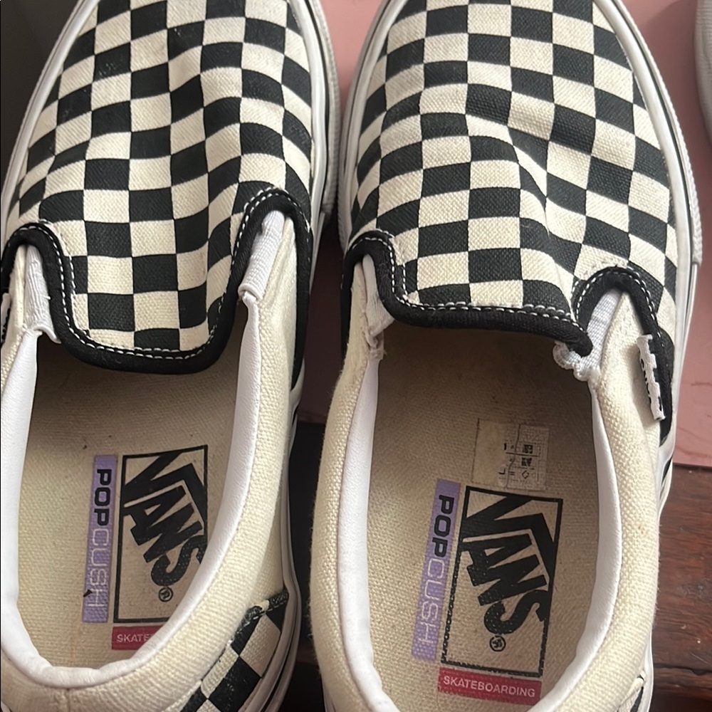 Vans Black and White Checkerboard Slip-On Sneakers